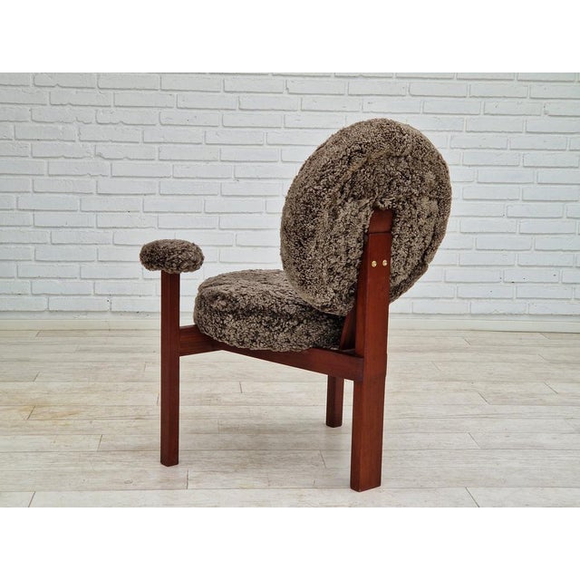 1960s, Danish design by Bent Møller Jepsen. Completely renovated-reupholstered armchair model "Medalie". renewed frame of...