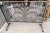 Forged iron firescreen with glass protection.