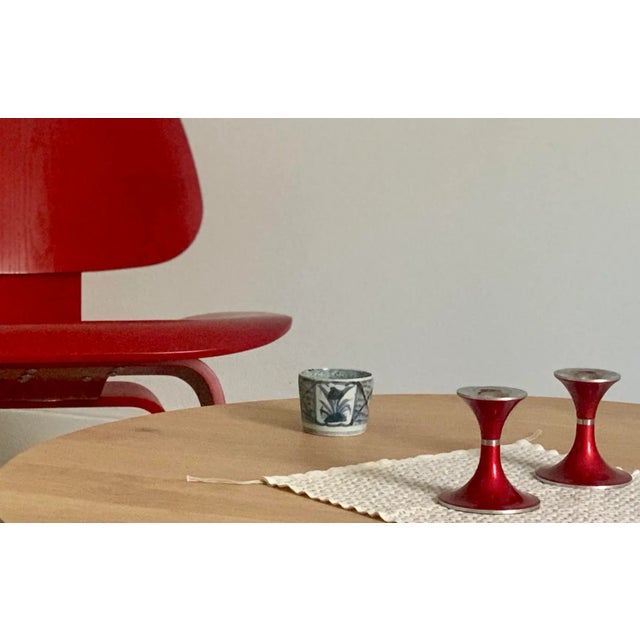 Vintage 1950s mid-century modern pair of candlestick holders by BJØRN ENGØ for Emalox of Norway. Aluminium with red...