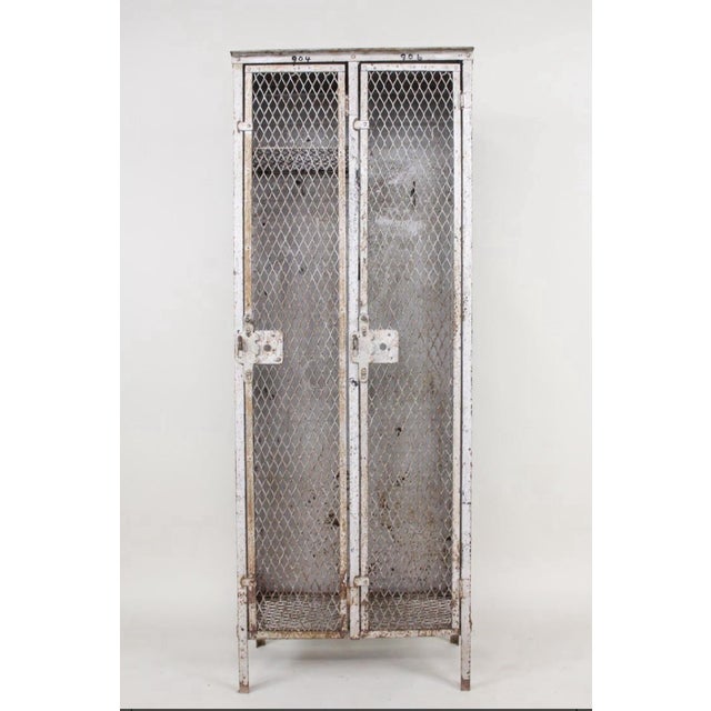 A very versatile metal French style locker. Probably from a factory for work or sport. Free standing it has been painted...