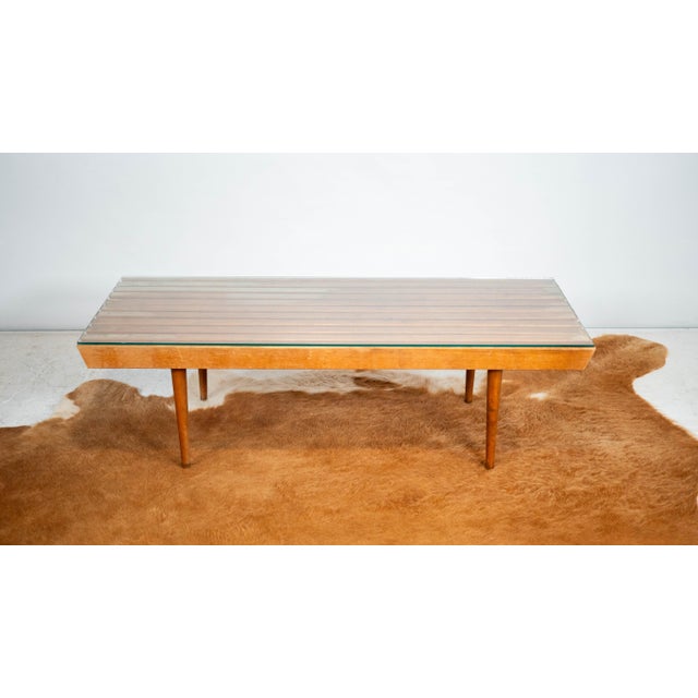 Mid Century Modern coffee table with glass top, circa 1970s. Reminiscent of George Nelson's platform slat bench...