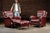 Vintage three-piece burgundy seating set. This elegant set includes two traditionally styled leather armchairs and a...