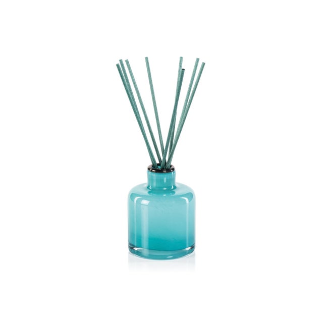 Our sophisticated Bottled Reed Diffuser adds a fragrant and comforting aroma to your favorite space! Glass vessel donned...