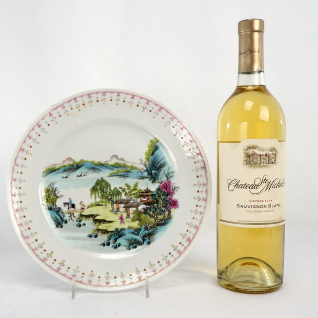 This antique Chinese porcelain cabinet plate is exceptionally finely painted and thinly potted, featuring a richly...