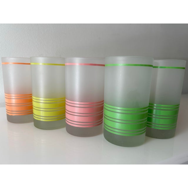 Eight Green, pink, yellow and orange striped retro barware. So perfect for your Miami or Palm Beach style bar cart.