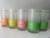 Eight Green, pink, yellow and orange striped retro barware. So perfect for your Miami or Palm Beach style bar cart.
