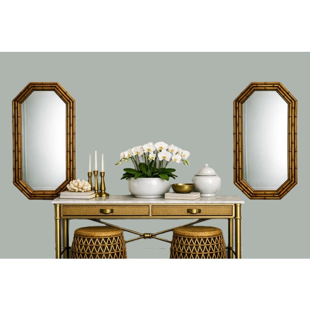 A striking pair of vintage faux‑bamboo octagonal mirrors, produced with mirror components by Lenoir Mirror Co. (backstamp...