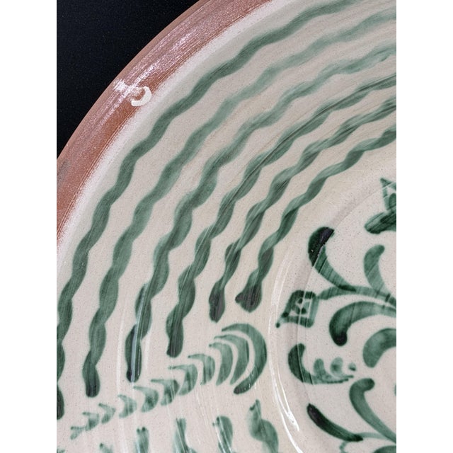 Large Spanish handmade and painted white and green glazed terracotta "Lebrillo" earthenware bowl in the style typical of...
