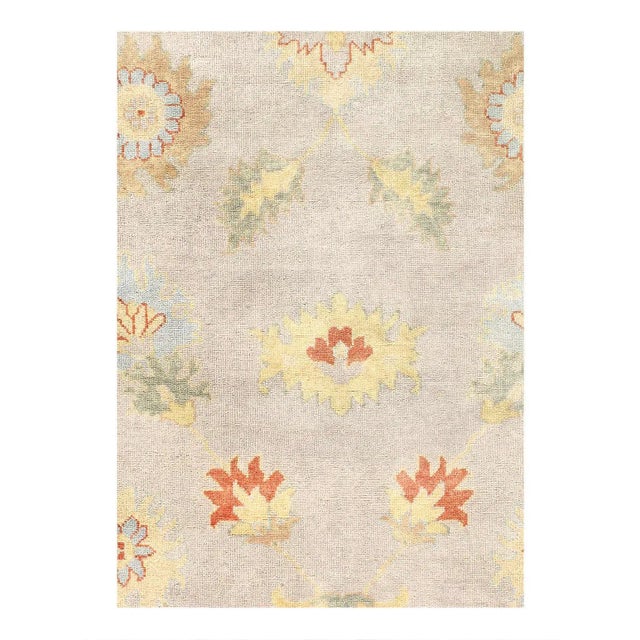 This Oushak Hand-Knotted Wool Gray Area Rug celebrated for its understated elegance, is greatly influenced by original...