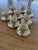 Lovely elegant set of eight gilt-rimmed cream-colored Lenox porcelain demitasse cups with sterling silver Wilcox and...