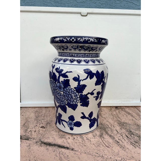 This Chinoiserie-style garden stool features a classic blue and white floral scroll or "White Cherry Blossom" This could...