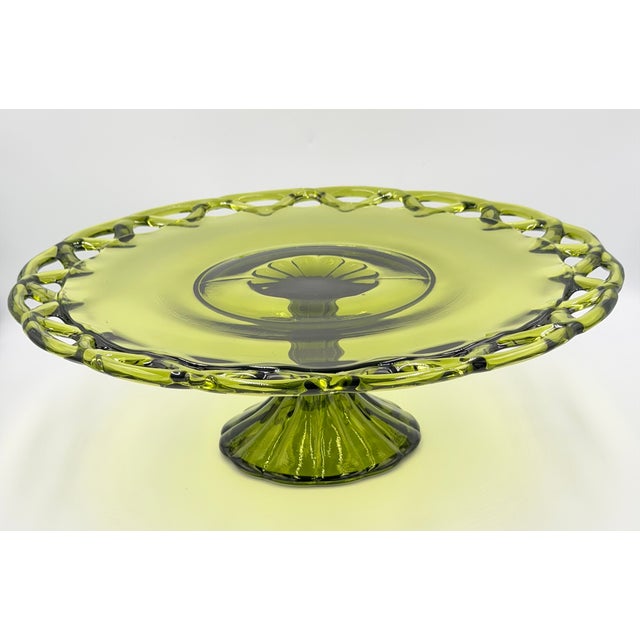 Beautiful vintage cake stand from the esteemed Pitman-Drietzer Glass Company. This piece features their exquisite "Colony...
