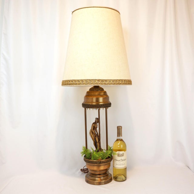 A vintage 1970s Greek Goddess Oil Rain Lamp with its original shade. The lamp was a popular decorative piece from that...