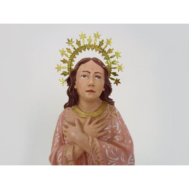 Plaster statue of the Virgin Mary with her hands crossed on her chest. J.M Cosamo 2004 Very beautiful Virgin Mary with her...