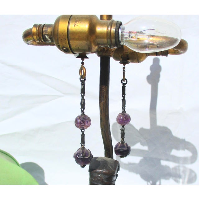 Ming Bronze figure, now mounted as a lamp in the early 20th century. Ming Period small bronze set into a lotus carved base...