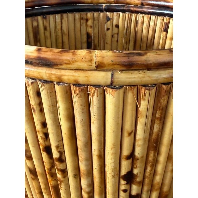 A charming pair of vintage bamboo cache pots that effortlessly bring warmth and texture to any space. Handcrafted with...