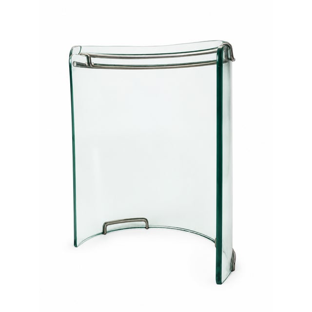 A striking 1978 modernist dining table, featuring an oversized oval top crafted from substantial polished Belgian crystal...