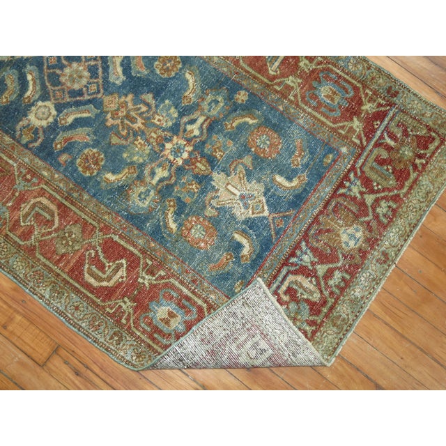 An early 20th century Antique Malayer Runner. We love the slight natural wear on this rug because it shows a real taste of...