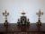 Triptych era Deco composed of a clock and deU candlesticks, of beautiful quality in black marble from Belgium and golden...
