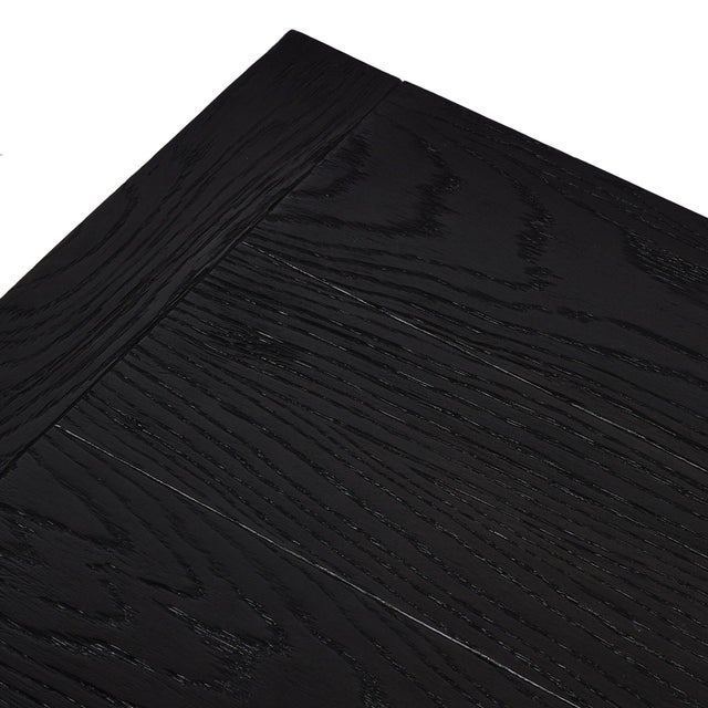 Black-finished oak shapes a streamlined coffee table with a rich while minimalist look.