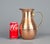 Vintage Hand Hammered Copper Pitcher with Brass Handle This lovely pitcher is made of hand-hammered copper with a...