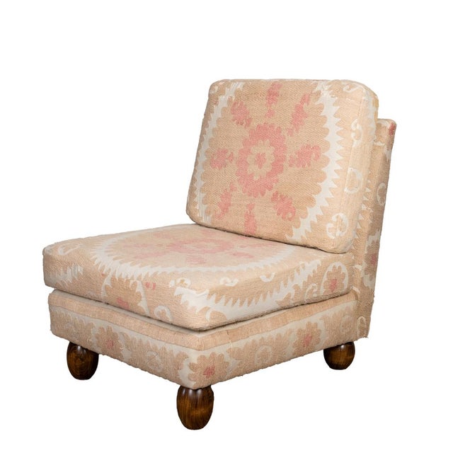 New slipper chair upholstered in a vintage, 1940's Suzani from Uzbekistan. The wood ball feet are a playful touch to the...
