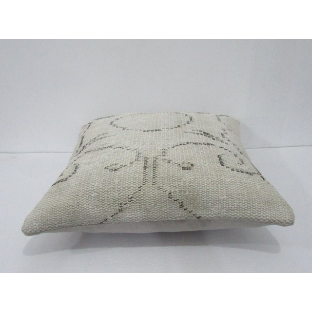 Decorative pillow cover made from a vintage Turkish handknotted rug. Backed with good quality cotton fabric. Pillow...