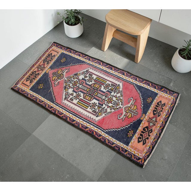 This exquisite hand-knotted vintage Turkish rug brings a touch of timeless Anatolian artistry to any cozy niche or entry...