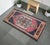 This exquisite hand-knotted vintage Turkish rug brings a touch of timeless Anatolian artistry to any cozy niche or entry...