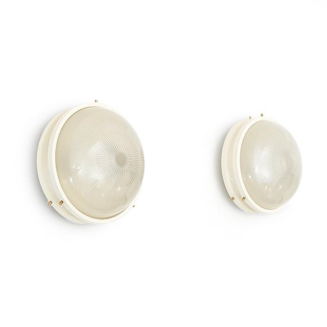 Pair of ceiling lamps produced by Artemide in the 1960s designed by Sergio Mazza. White painted metal structure. Pressed...