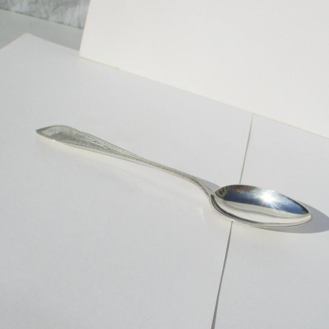 Sterling Silver Danish JFH spoon. Large spoon with bright cut markings. Monogramed SE and makers mark is JFH. the length...