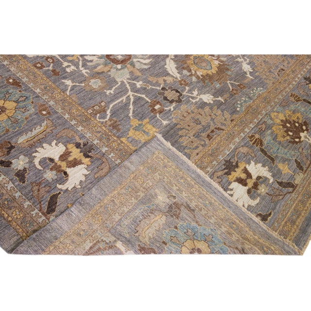 Beautiful modern Sultanabad hand-knotted wool rug with a gray color field. This rug has a designed frame with golden,...