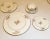 A 42-piece Lenox Harvest china dinnerware service for eight, decorated with a wheat motif and gold trim. The set includes:...
