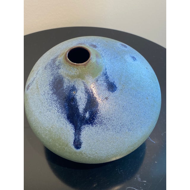 Elevate your home décor with this exquisitely crafted pottery vase, a piece that beautifully blends organic form with a...