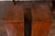 A pair of Italian walnut commodini from the mid-19th century, with three drawers and bun feet. This pair of mid-19th...