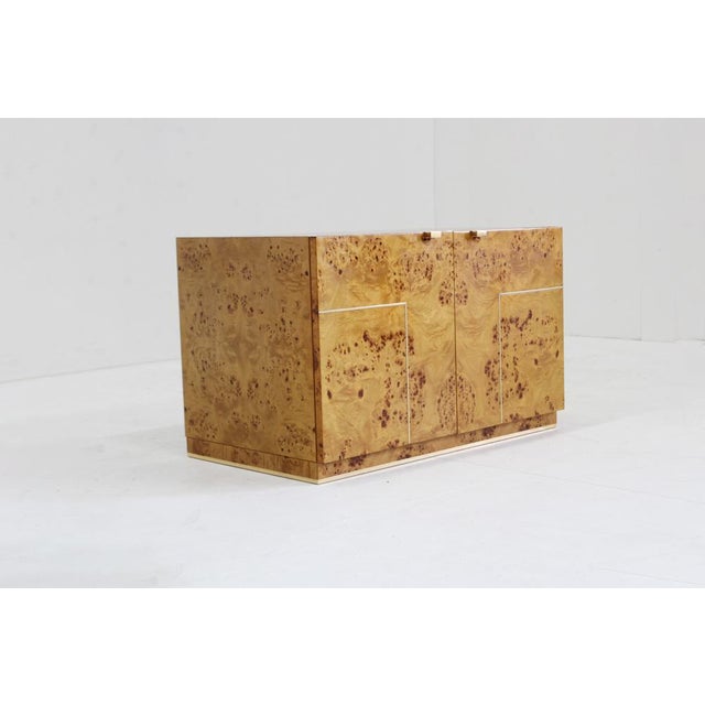 Vintage burl wood sideboard 1970s Italy Vintage burl wood sideboard with brass details from the 1970s Italy. Vintage...