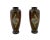 A pair of Japanese enamel over copper vases. Each vase has an urn shaped body and a wide neck. Each ware is enameled with...