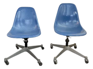 Pair of Eames for Herman Miller Blue Fiberglass Rolling Chairs