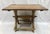 Antique hand crafted trestle table. Imported from France. The base is crafted from rustic wood and painted with layers of...