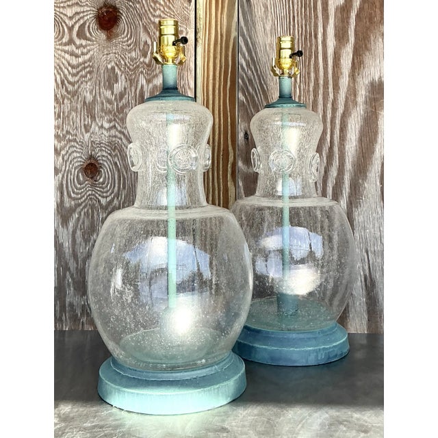 A charming pair of vintage boho-style blown glass lamps that blend artistry and functionality. These unique pieces feature...