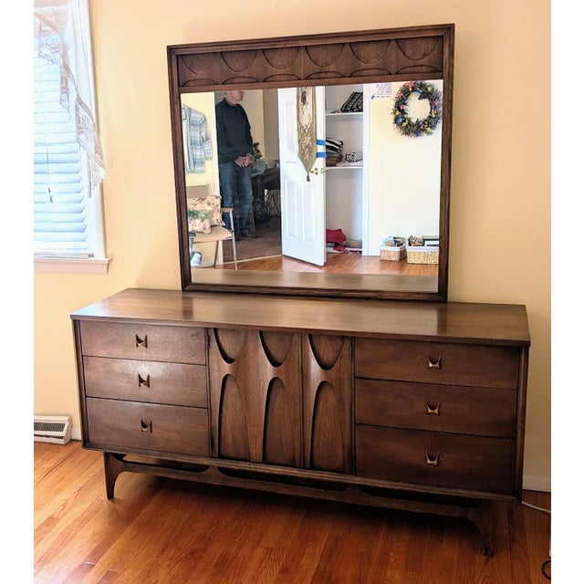 Stunning MCM Broyhill Brasilia triple dresser with matching mirror. This architectural designed pieces have attractive...