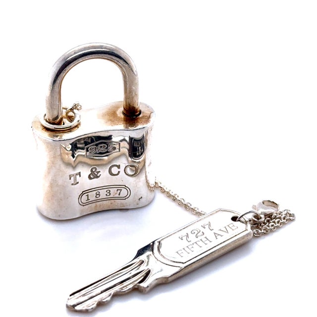 A rare Tiffany & Co. 1837 padlock key chain crafted in sterling silver, featuring a distinctive padlock motif engraved...