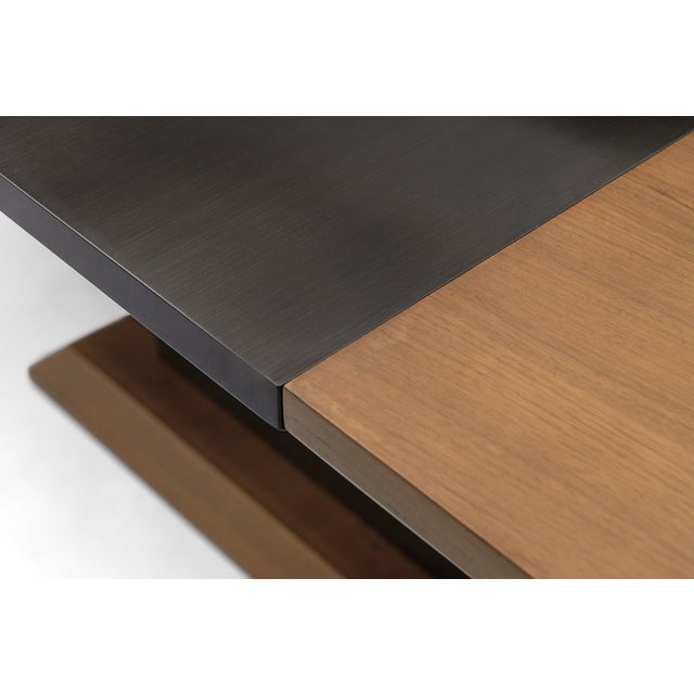 Walnut and Bronze Extension Dining Table Designed by Greg Sheres. The "Barcelona" dining table features an elegant...