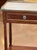 A elegant 19th century French mahogany side table with a pierced brass gallery top and brass molding along the top edge. A...