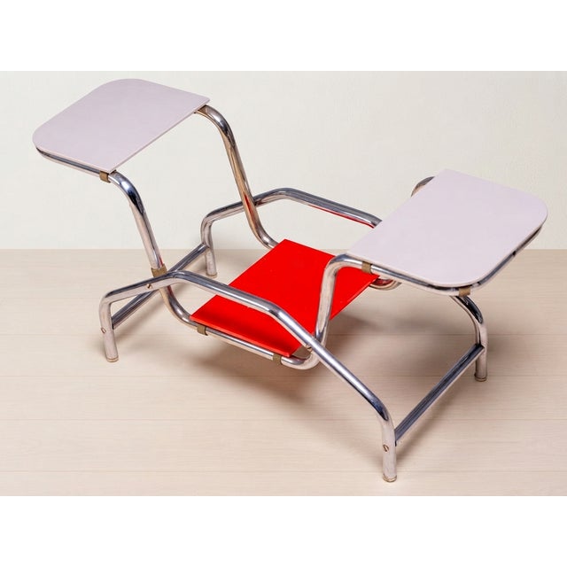 An elegant Bauhaus tubular steel flower stand from mid-20th century Czechoslovakia, featuring a chrome-plated tubular...