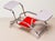 An elegant Bauhaus tubular steel flower stand from mid-20th century Czechoslovakia, featuring a chrome-plated tubular...