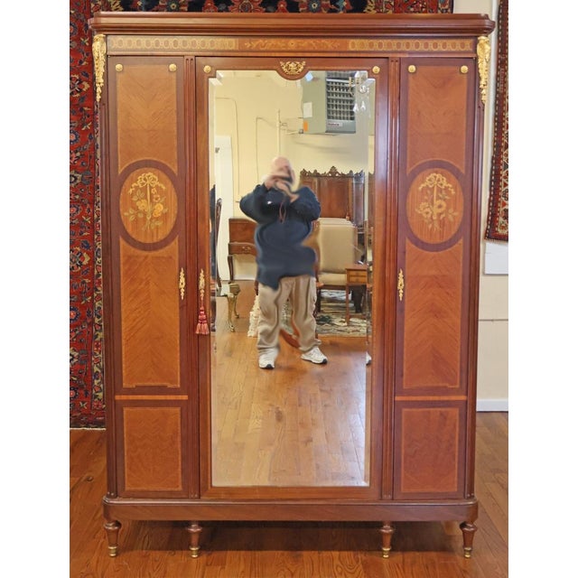 Late 19th Century Satinwood Inlaid Bronze Mounted Beveled Mirror Armoire Dimensions : 89" Tall X 64" Wide X 20" Deep This...