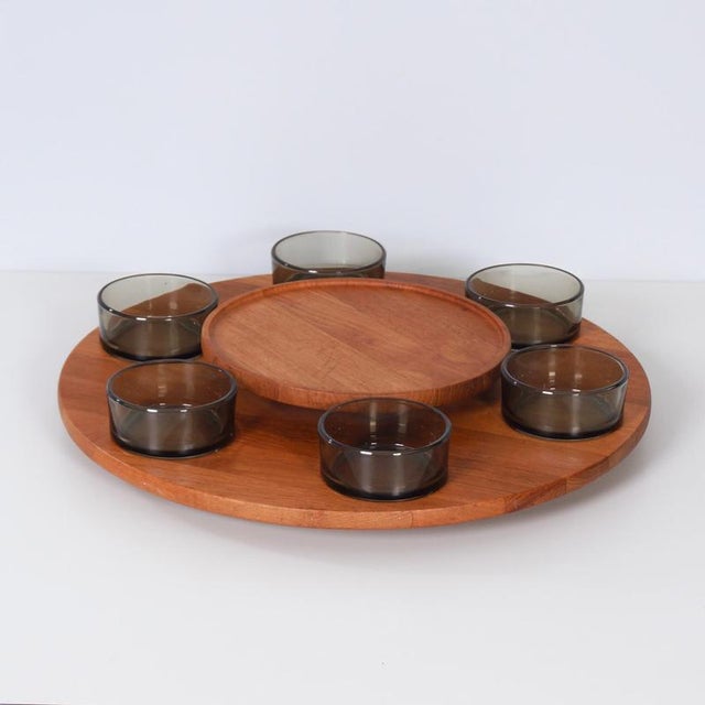 Lazy Susan with 6 bowls from Denmark (1960s). This large teak snack tray rotates smoothly, while the center section...