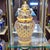 A late twentieth-century Thai Benjarong porcelain covered jar, hand painted in an elaborate cobalt blue, cream, red and...