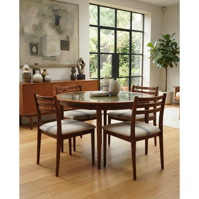A stunning and matching set of 4 fully refurbished vintage dining chairs, featuring rich dark-toned solid wooden frames...